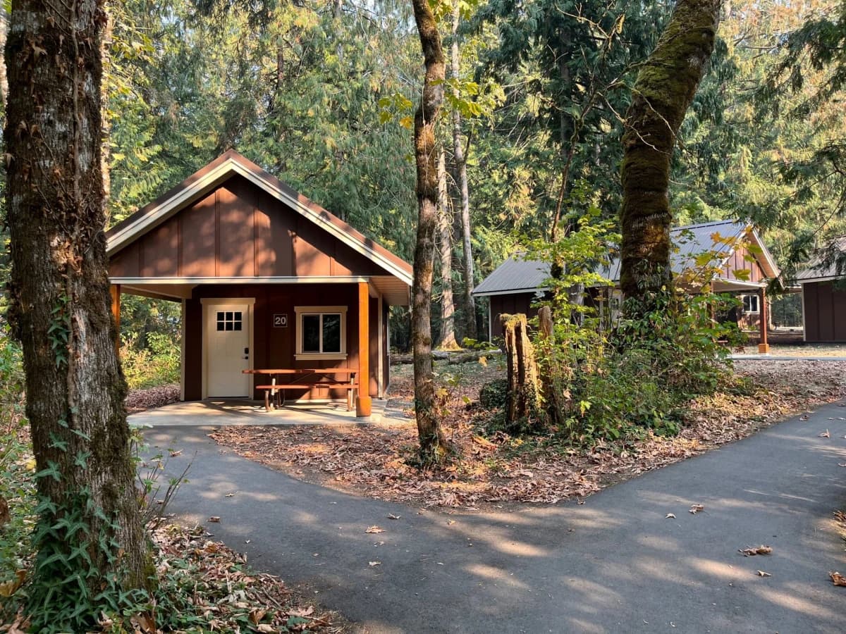 Actual Maple Bay cabin nestled among trees at Cultus Lake Provincial Park.